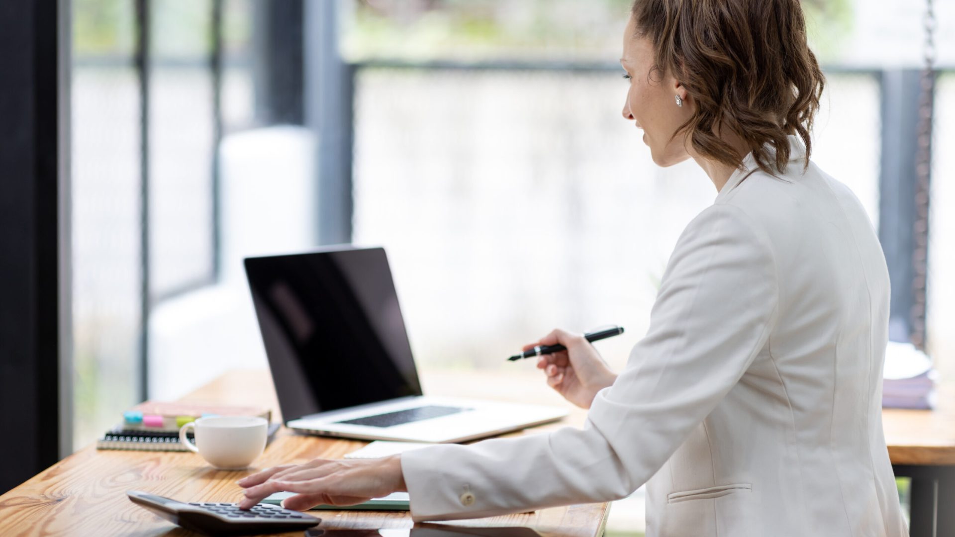 Confident millennial Canada female business analyst financial advisor preparing statistic report studying documents on work, finance analysis graph chart corporate economy, banking, market research