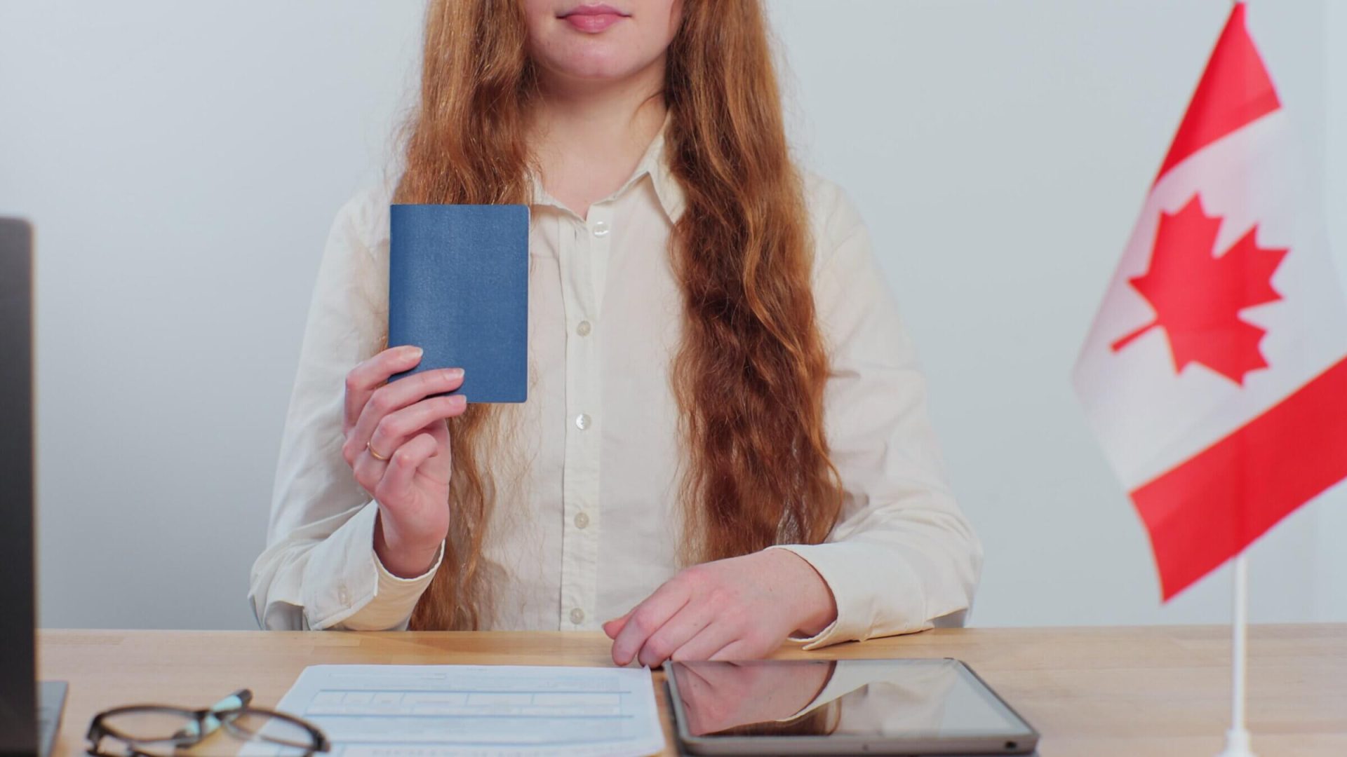 Canadian woman consular officer showing passport immigrant, work visa, citizenship. Visa Application online form immigration concept. Visa approval.